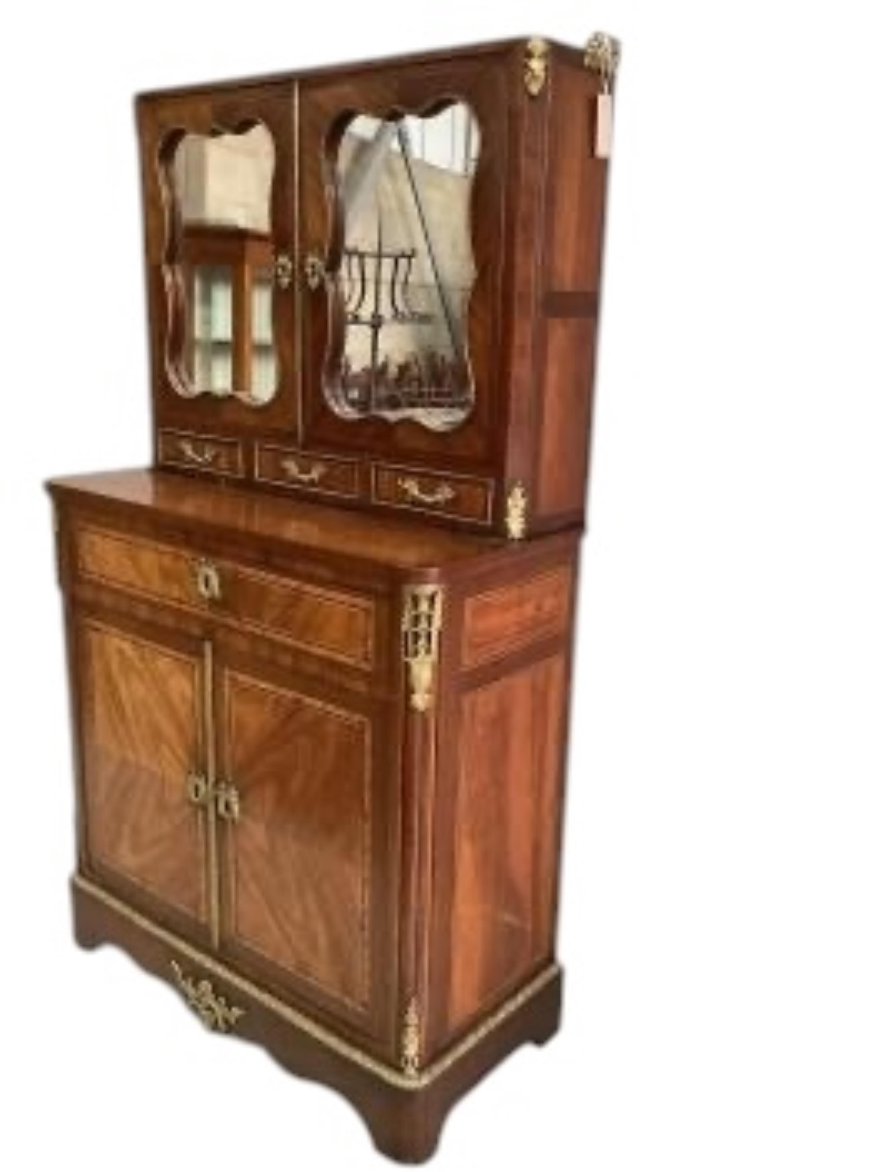 A Louis XVI style gilt metal mounted walnut and mahogany side cabinet, width 80cm, depth 37cm, height 142cm